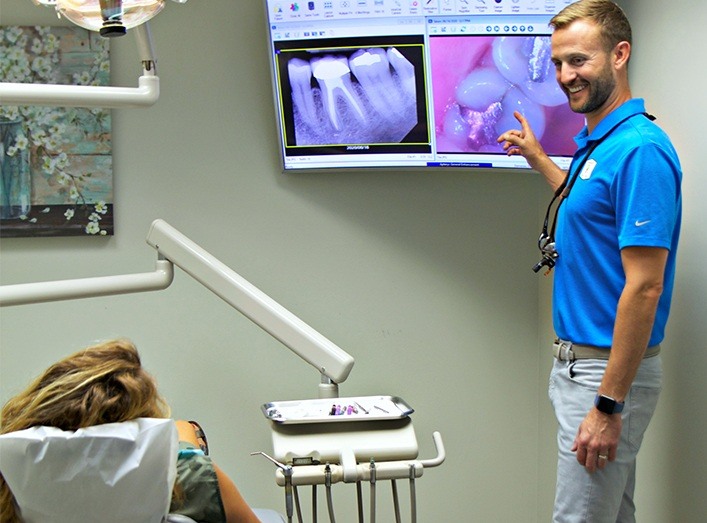 Doctor Hickey showing dental patient intraoral images