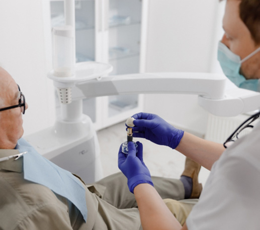Dental patient listening to dentist discuss dental 