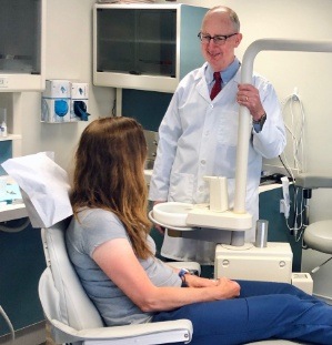 Dental patient and dentist in dental exam room