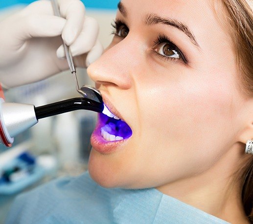 Woman receiving dental bonding treatment