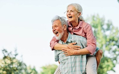 a mature couple with dentures spending time together