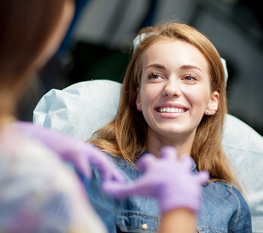 Woman in dental chair smiling