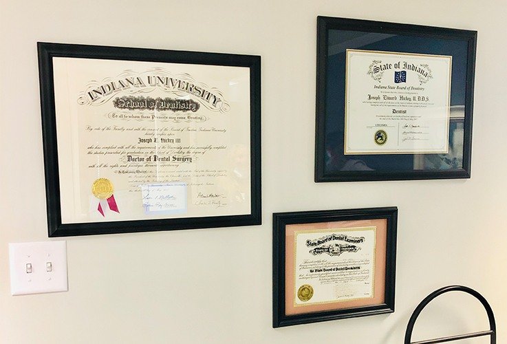 Diplomas on dental office wall