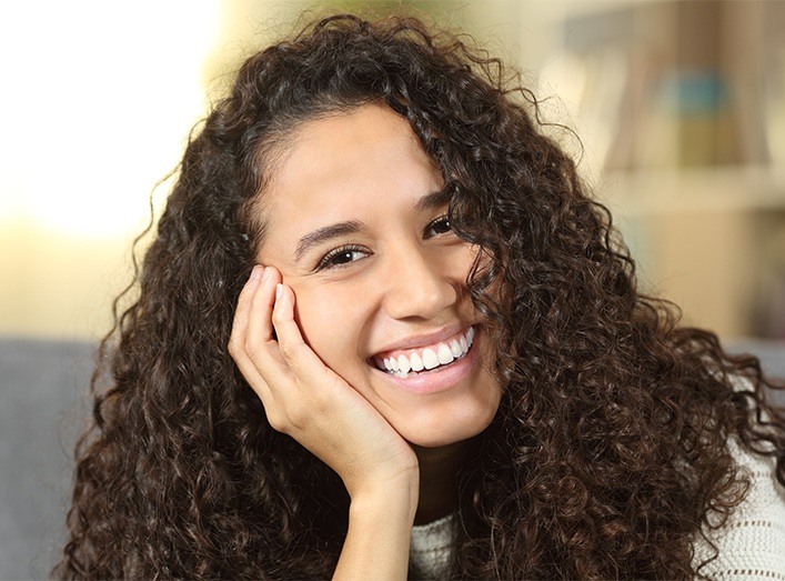 Woman with healthy smile after gum disease treatment