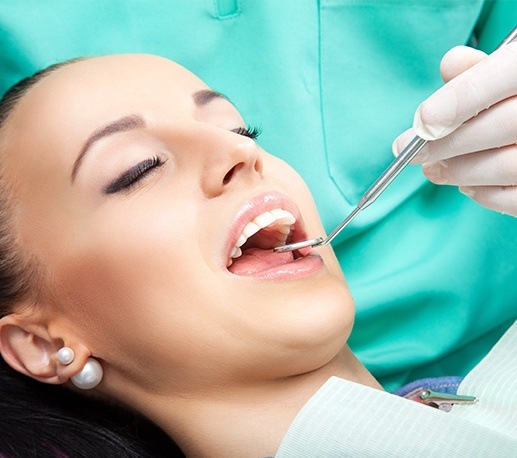 Woman receiving dental checkup