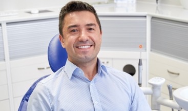 Man in dental chair for preventive dentistry appointment