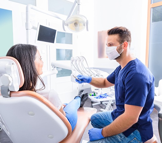 Woman getting porcelain veneers placed in Granger