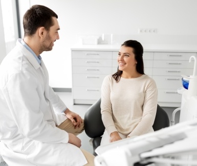 Dentist and patient discussing dental care