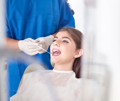 Woman receiving preventive dentistry exam