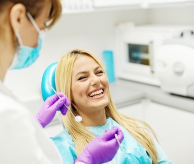 Laughing woman in dental chair