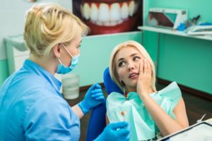 Woman in pain at emergency dentist